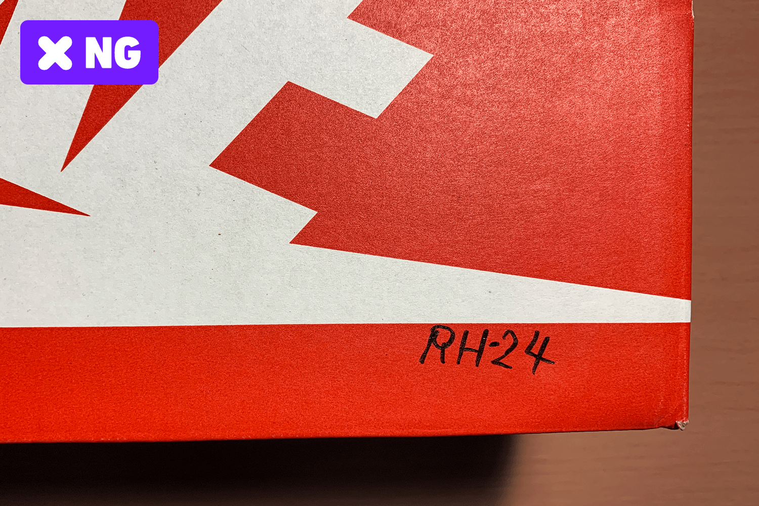 Graffiti and writing marks on the box.