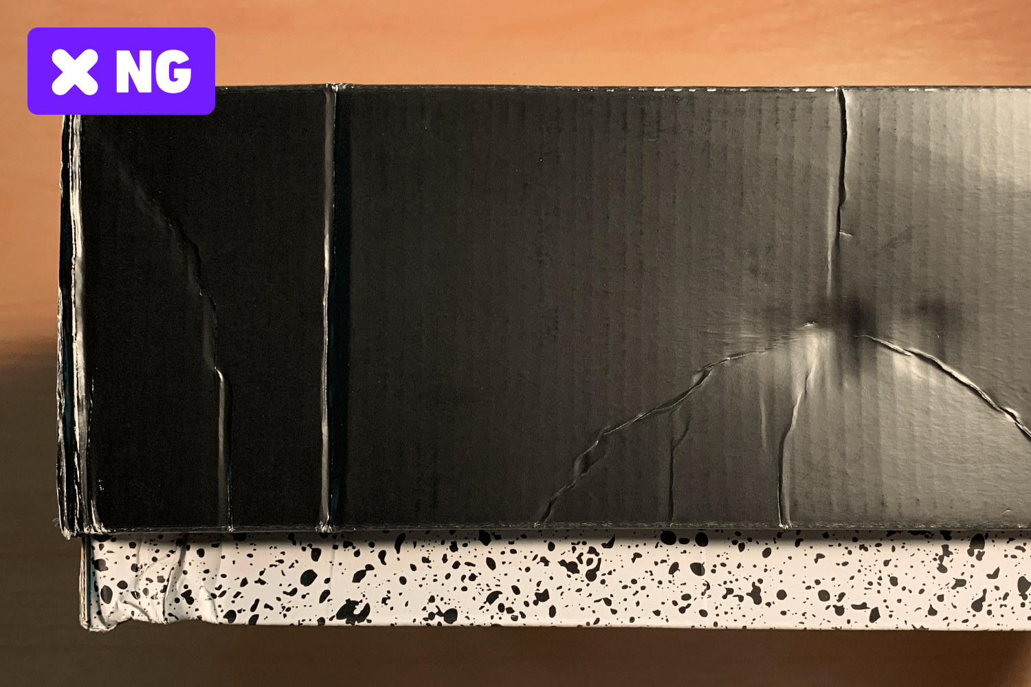 Large dents or wrinkles on the box surface