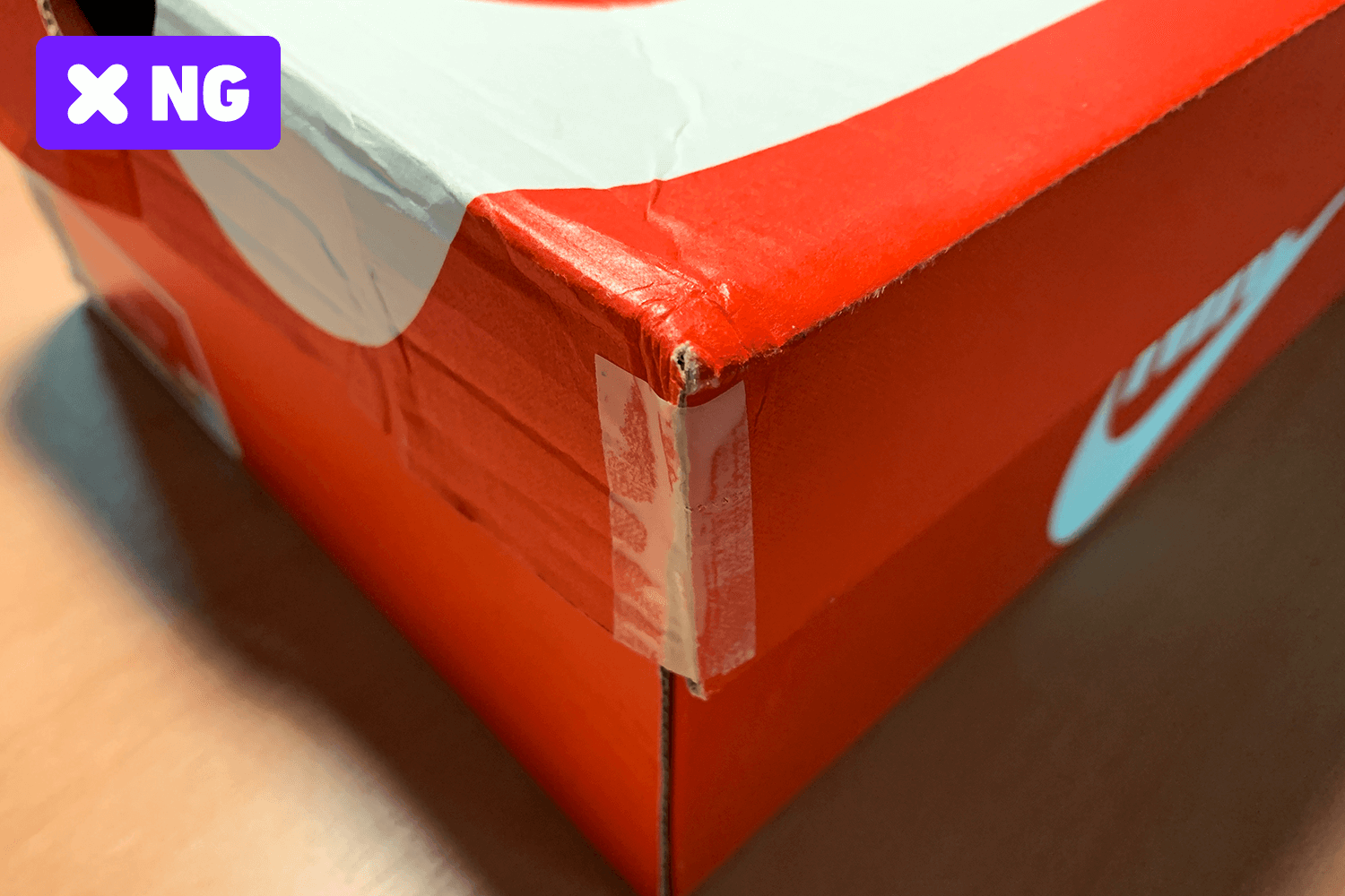 Taping off the damaged part of the box.