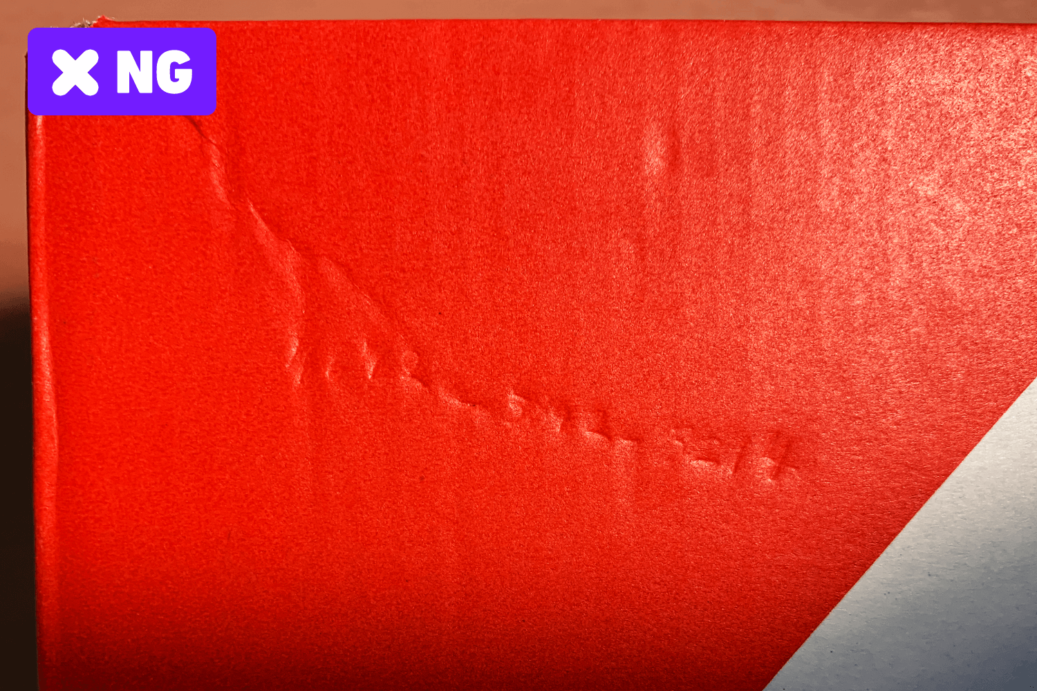 Graffiti and writing marks on the box.